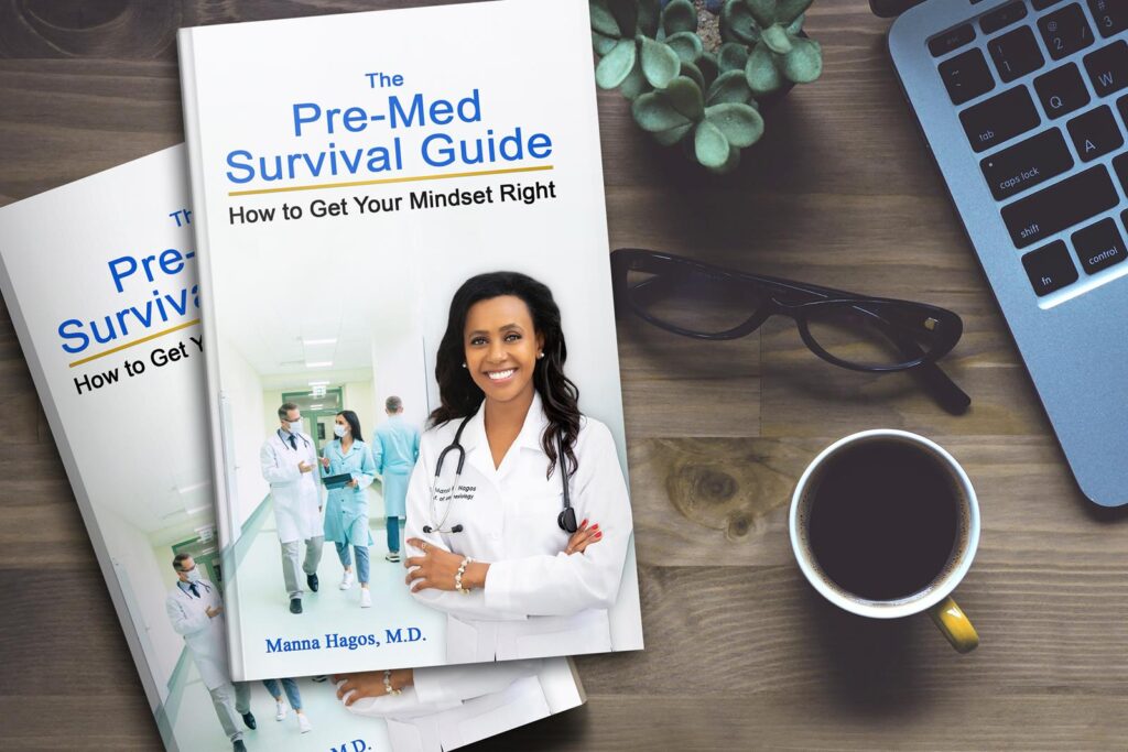 3d display of The PreMed Survival Guidebook on a desk next to a cup of coffee, a laptop and a pair of glasses.